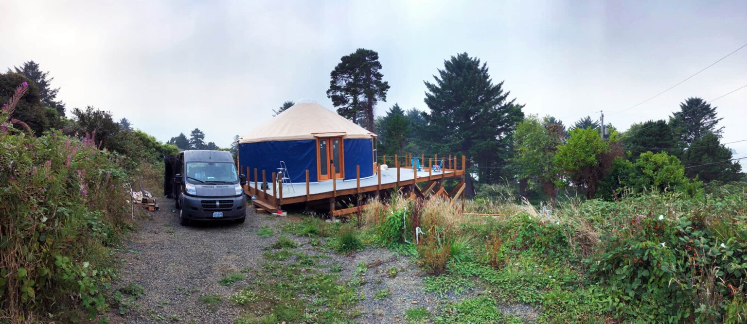 camper van parked outside of tent