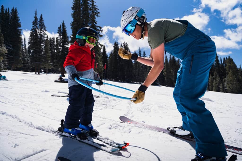 Young boy getting ski lessons in Colorado