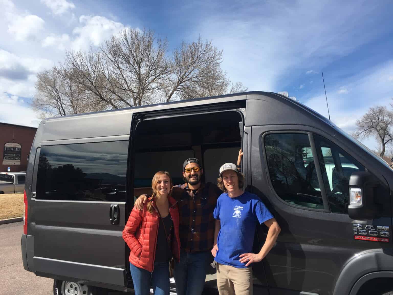 friends in front of a camper van conversion colorado