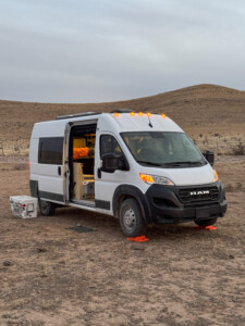 outside picture looking at a camper van with door open